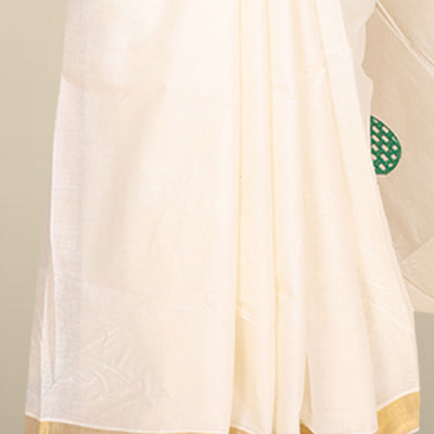 Cream kerala saree features thread embroidered leaf designs all over its body & pallu, zari border