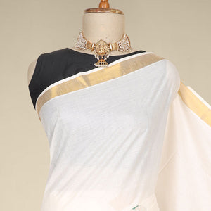 Cream kerala saree features thread embroidered leaf designs all over its body & pallu, zari border