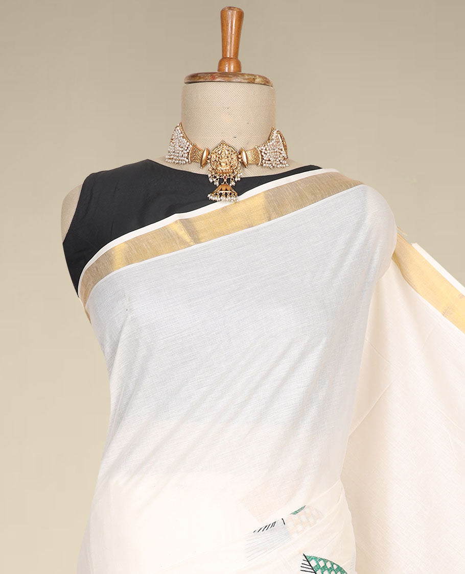 Cream kerala saree features thread embroidered leaf designs all over its body & pallu, zari border