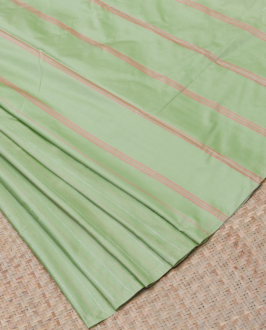 Borderless pistachio green aarani gift saree with zig-zag stripes on its body, self-pallu of stripes