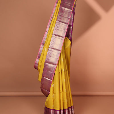 Green floral buttas silk saree with contrast border of muthu, manga , kuyil kann design & floral zari design pallu