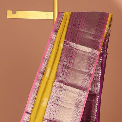 Green floral buttas silk saree with contrast border of muthu, manga , kuyil kann design & floral zari design pallu