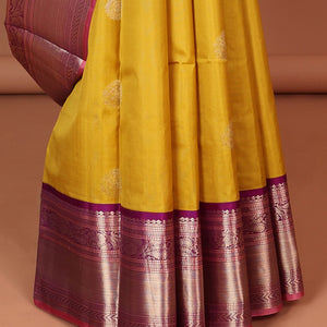 Green floral buttas silk saree with contrast border of muthu, manga , kuyil kann design & floral zari design pallu