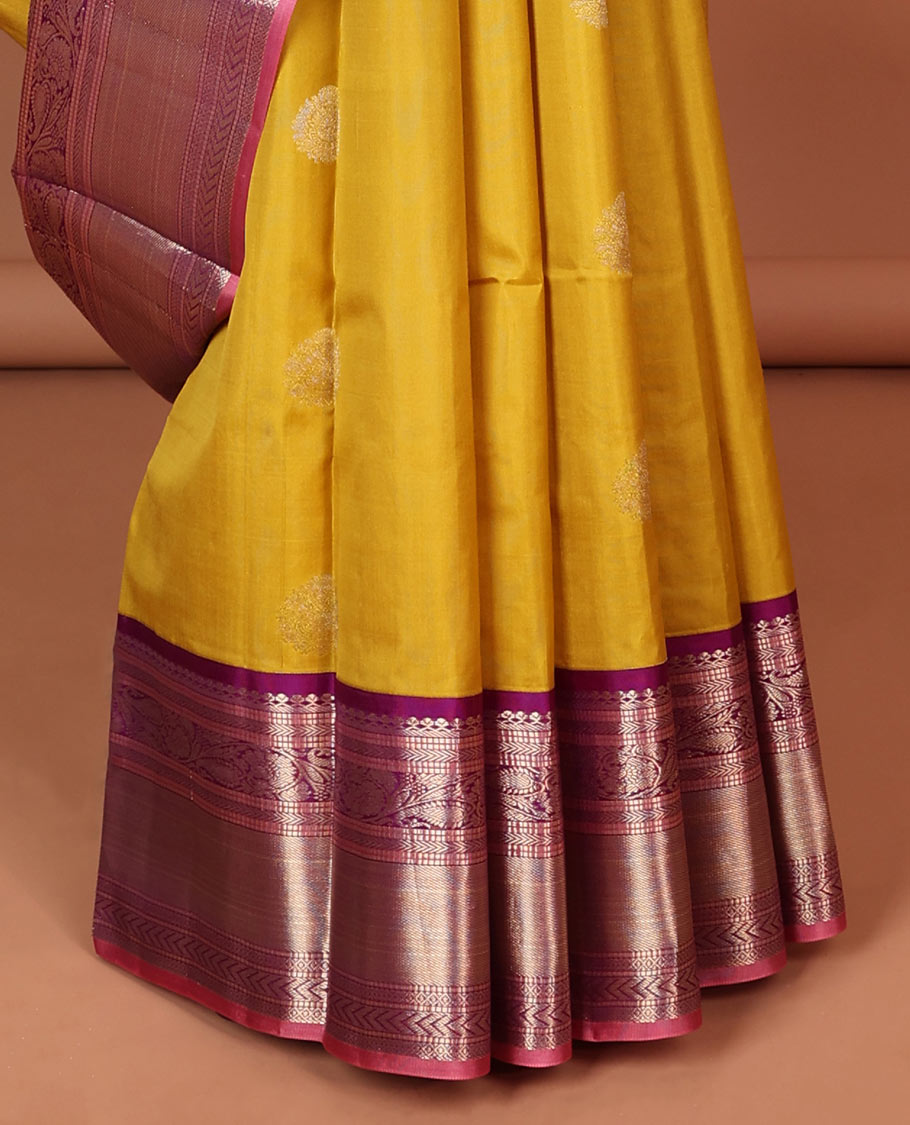 Green floral buttas silk saree with contrast border of muthu, manga , kuyil kann design & floral zari design pallu