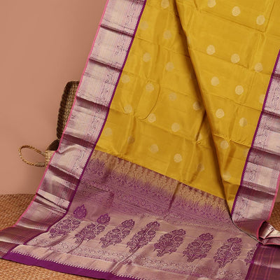 Green floral buttas silk saree with contrast border of muthu, manga , kuyil kann design & floral zari design pallu