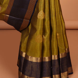 Green butta vasundhara elite silk saree with contrast zari striped border & striped, zari buttas zari design pallu