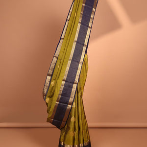 Green butta vasundhara elite silk saree with contrast zari striped border & striped, zari buttas zari design pallu
