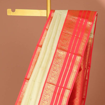 Cream floral buttas silk saree with korvai border of rekku , mayil design & intricate jaal zari design pallu