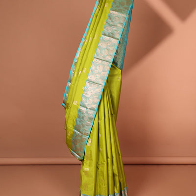 Green floral buttas silk saree with contrast leaf design border &  intricate jaal zari design pallu
