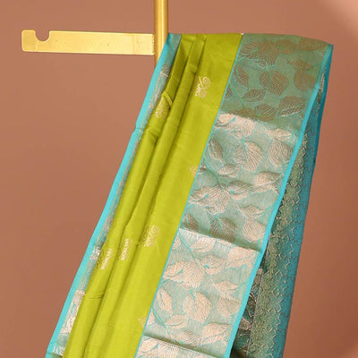 Green floral buttas silk saree with contrast leaf design border &  intricate jaal zari design pallu