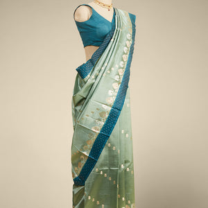 Green  floral motifs dupion silk saree with contrast zari border