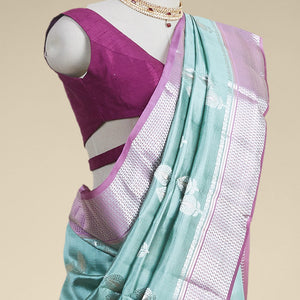 Green  floral motifs dupion silk saree with contrast intricate zari design border