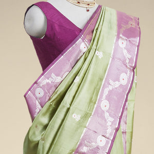 Green floral motifs dupion silk saree with contrast floral vine zari border