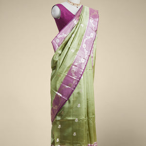 Green floral motifs dupion silk saree with contrast floral vine zari border