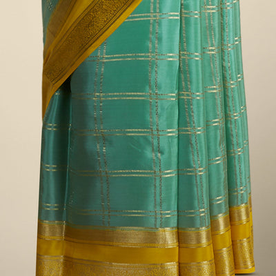 Green checked mysore silk saree with contrast intricate zari border