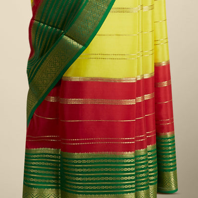 Yellow striped design mysore silk sare with contrast traditional zari border