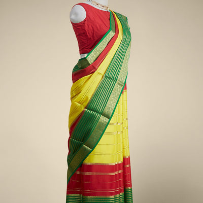 Yellow striped design mysore silk sare with contrast traditional zari border