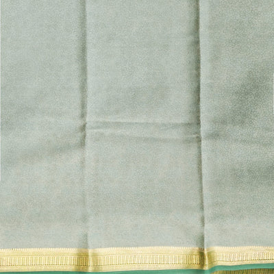 Green floral printed silk saree with contrast zari border