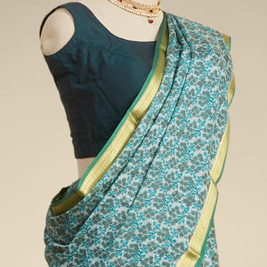 Green floral printed silk saree with contrast zari border