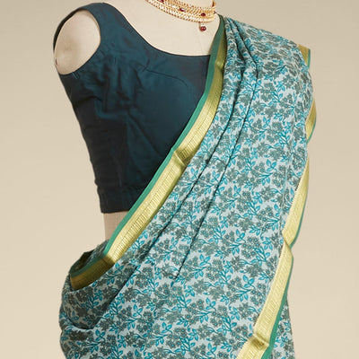 Green floral printed silk saree with contrast zari border