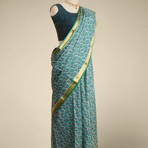 Green floral printed silk saree with contrast zari border