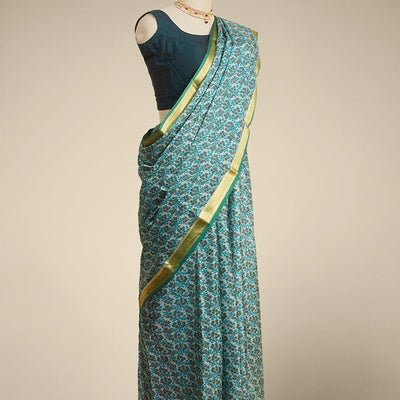 Green floral printed silk saree with contrast zari border
