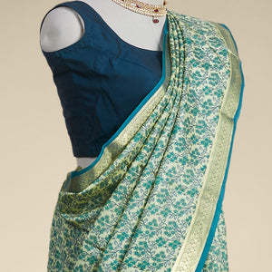 Green floral printed silk saree with contrast zari border