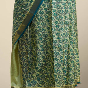 Green floral printed silk saree with contrast zari border