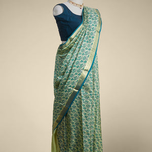 Green floral printed silk saree with contrast zari border