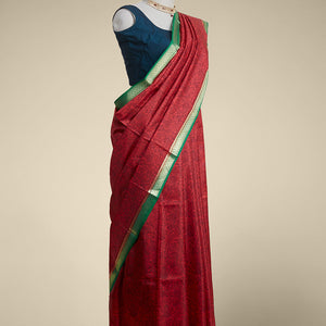 Red floral printed silk saree with contrast zari border