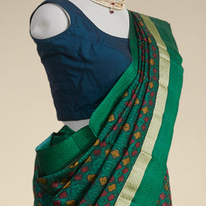 Green geometric printed silk saree with contrast intricate design border