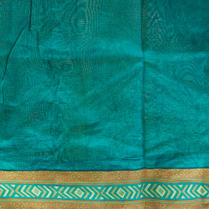 Green geometric printed silk saree with contrast geometric  design border