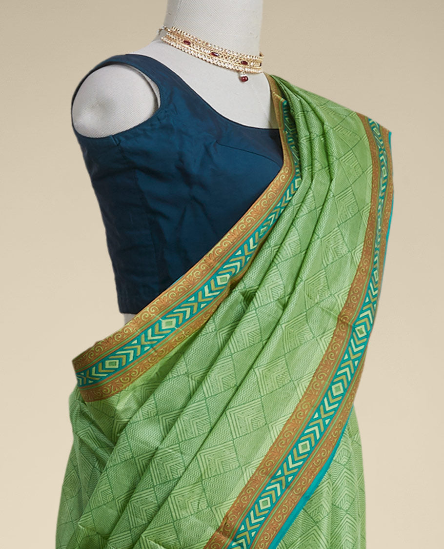 Green geometric printed silk saree with contrast geometric  design border