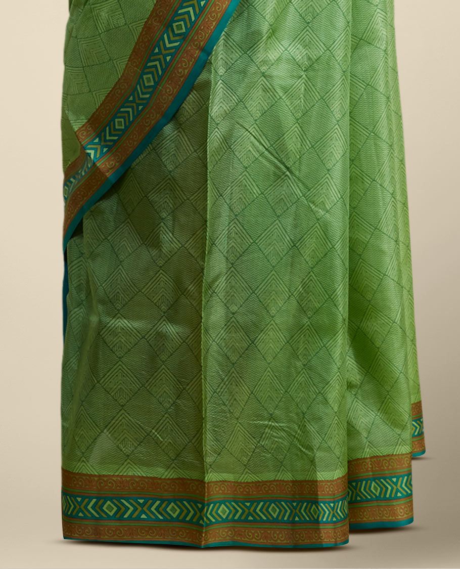 Green geometric printed silk saree with contrast geometric  design border
