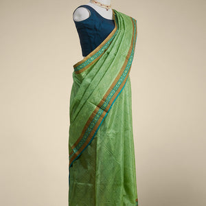 Green geometric printed silk saree with contrast geometric  design border