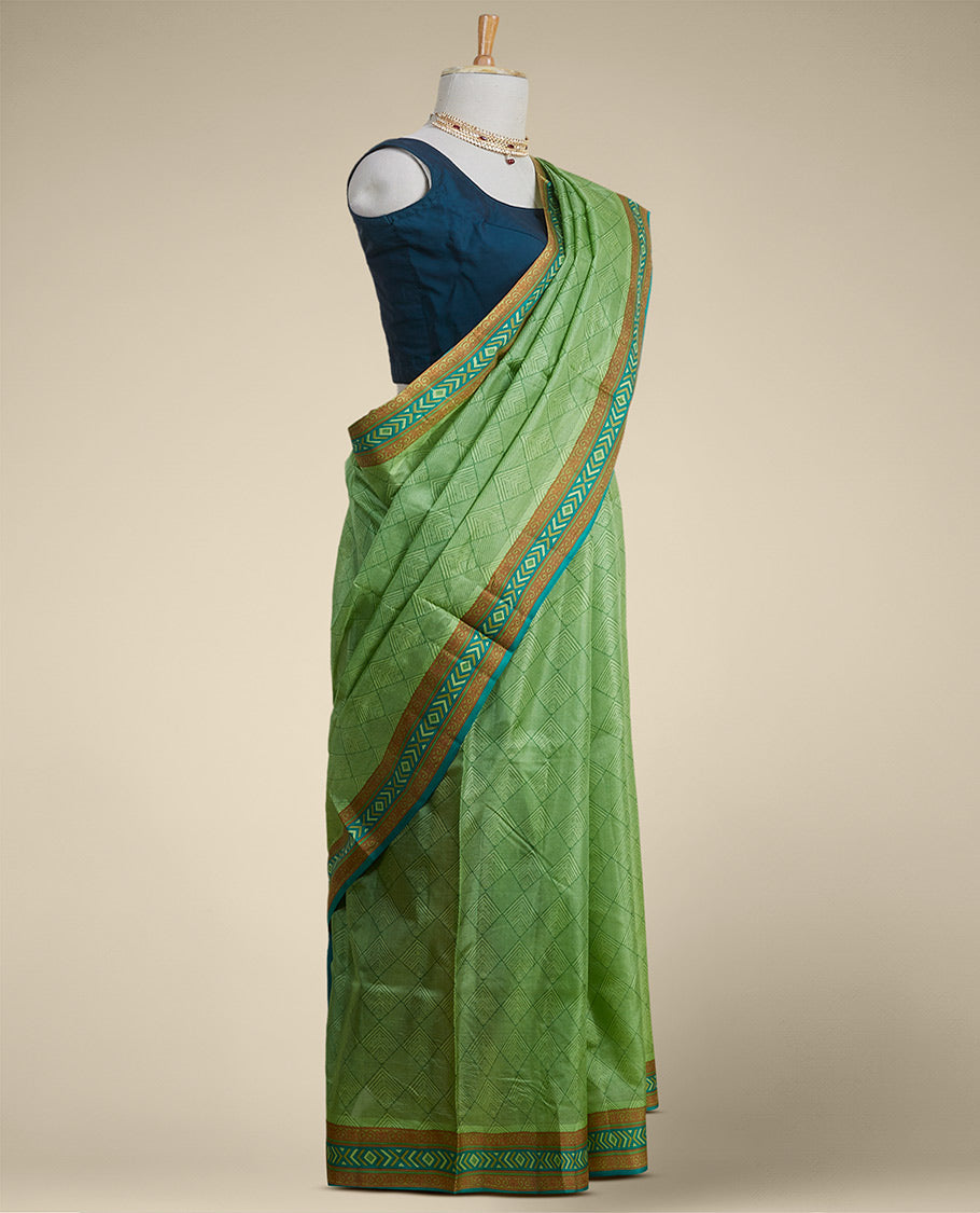 Green geometric printed silk saree with contrast geometric  design border