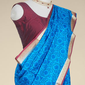 Blue floral printed silk saree with contrast intricate zari design border