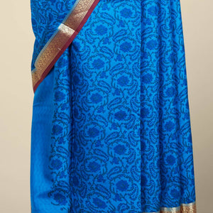 Blue floral printed silk saree with contrast intricate zari design border