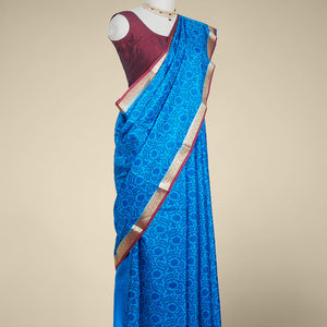 Blue floral printed silk saree with contrast intricate zari design border