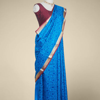 Blue floral printed silk saree with contrast intricate zari design border
