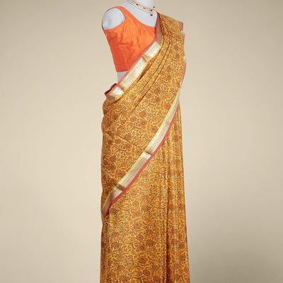 orange  floral printed silk saree with contrast intricate zari design border