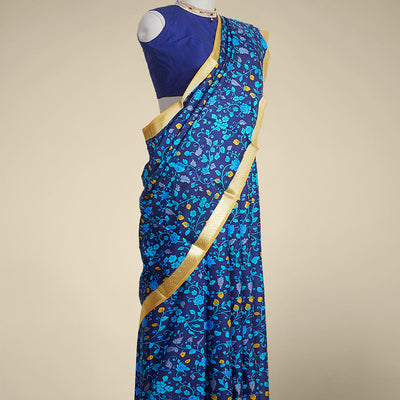 Blue floral vine design printed silk saree with contrast intricate zari border