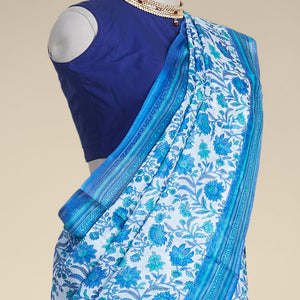 Blue floral vine design printed silk saree with contrast striped zari border