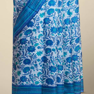Blue floral vine design printed silk saree with contrast striped zari border