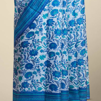 Blue floral vine design printed silk saree with contrast striped zari border