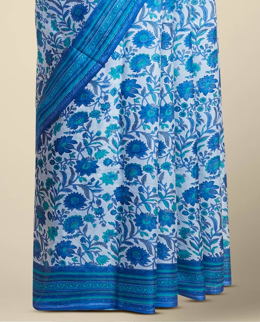 Blue floral vine design printed silk saree with contrast striped zari border