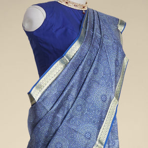 Blue floral kaleidoscopic design printed silk saree with contrast intricate zari border