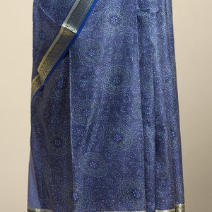 Blue floral kaleidoscopic design printed silk saree with contrast intricate zari border