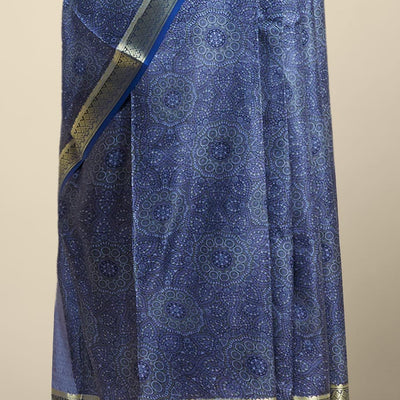 Blue floral kaleidoscopic design printed silk saree with contrast intricate zari border