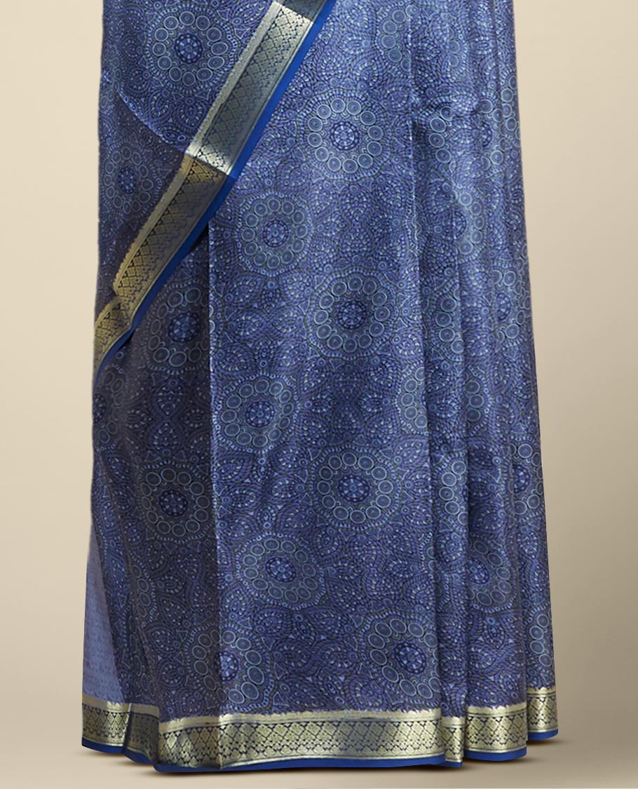 Blue floral kaleidoscopic design printed silk saree with contrast intricate zari border